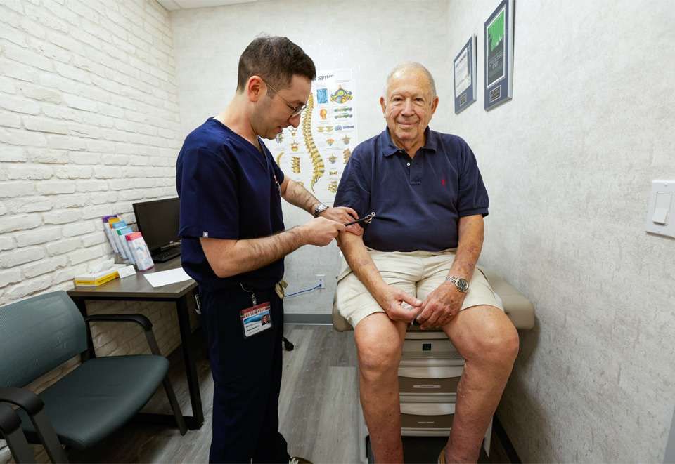 Dr. Dmitriy Dvoskin MD with patient